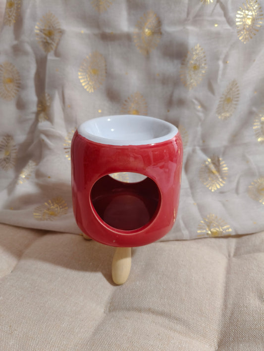 Quemador rojo con patas de madera