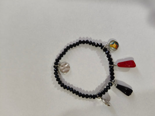 Pulsera con el puño de fija y santos